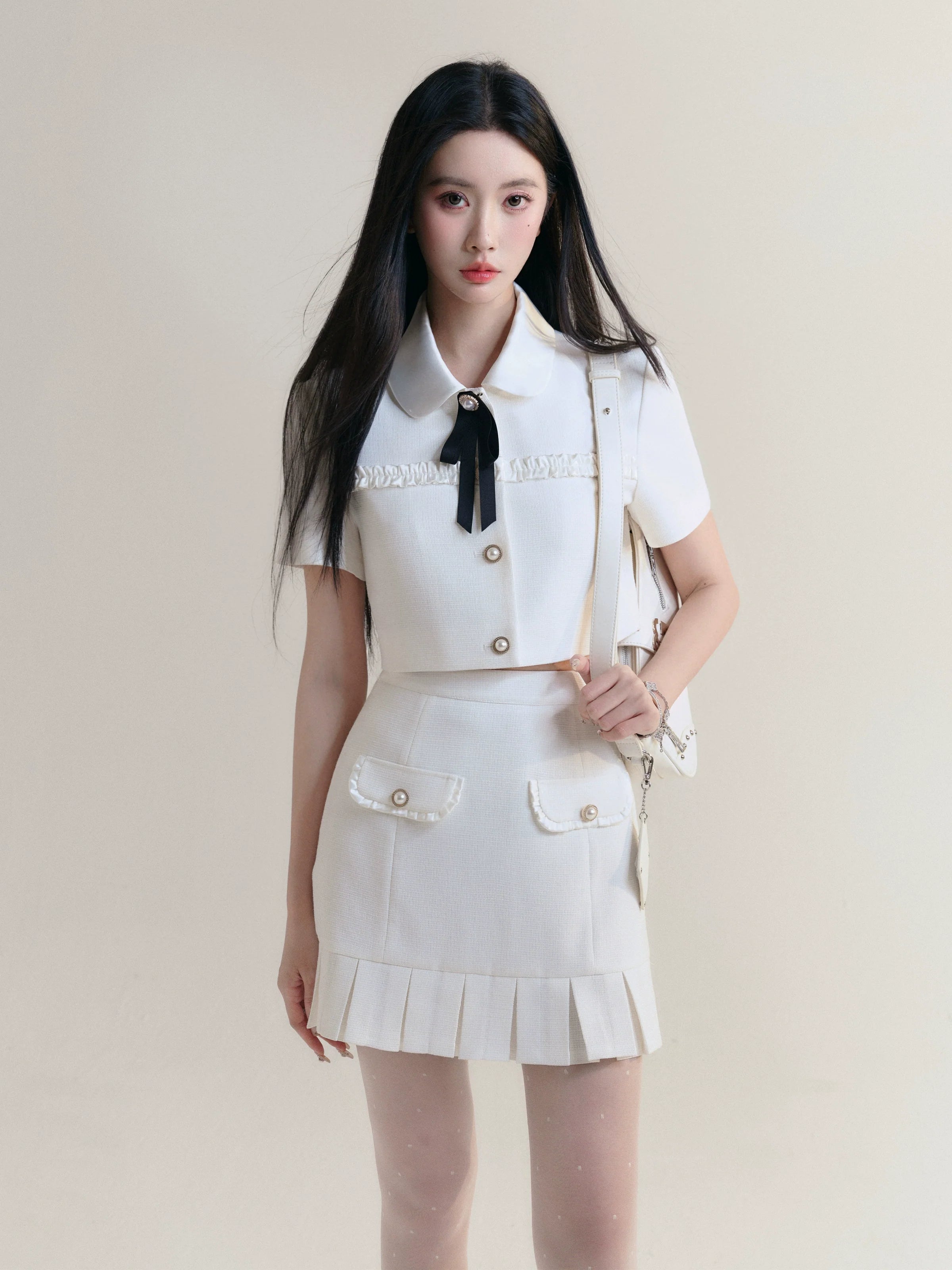 Ivory Elegance Bow-Tie Crop Blouse and Pleated Mini Skirt Set Embroidered Cotton Blouse Ivory Elegance Bow-Tie Crop Blouse and Pleated Mini Skirt Set Embroidered Cotton Blouse